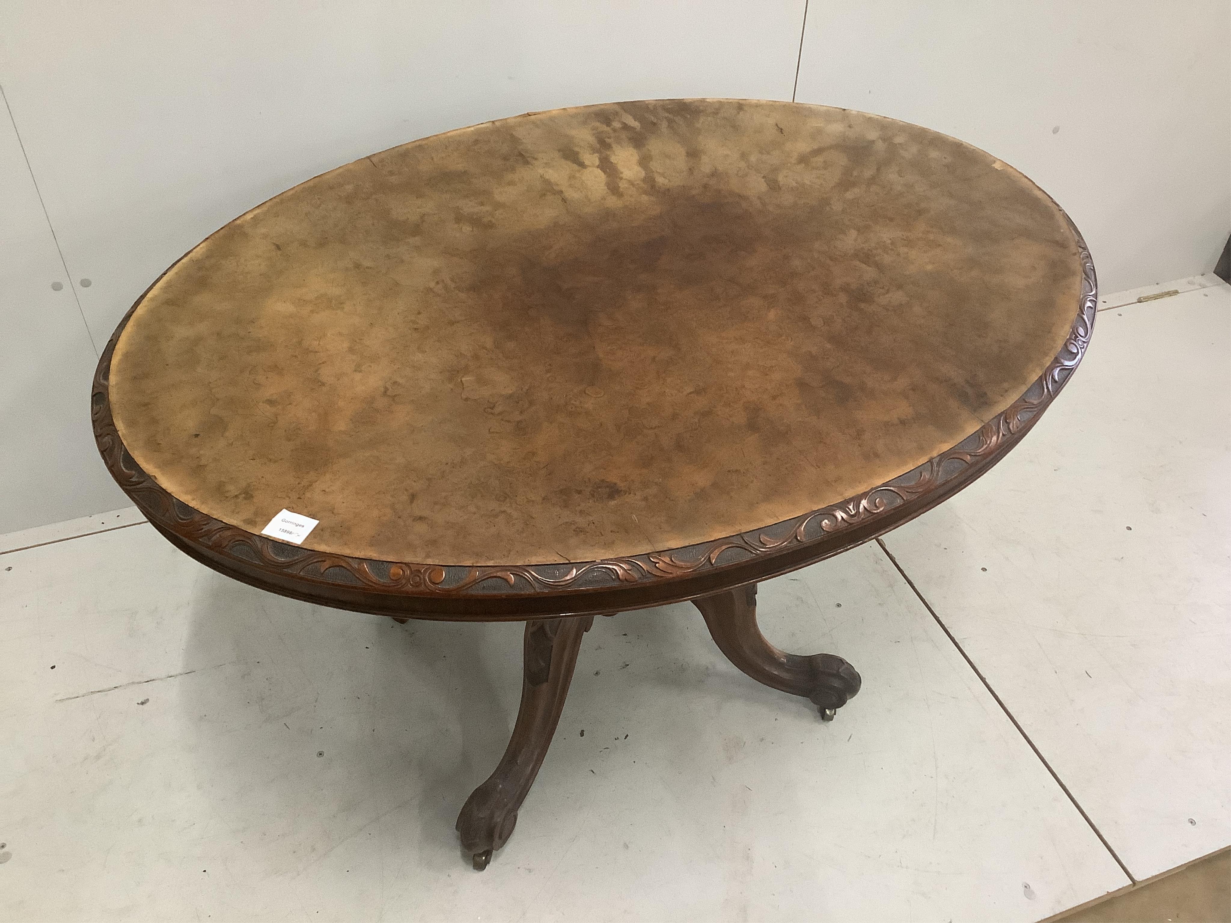 A Victorian carved walnut oval tilt top breakfast table, 120 x 92cm, height 72cm. Condition - fair